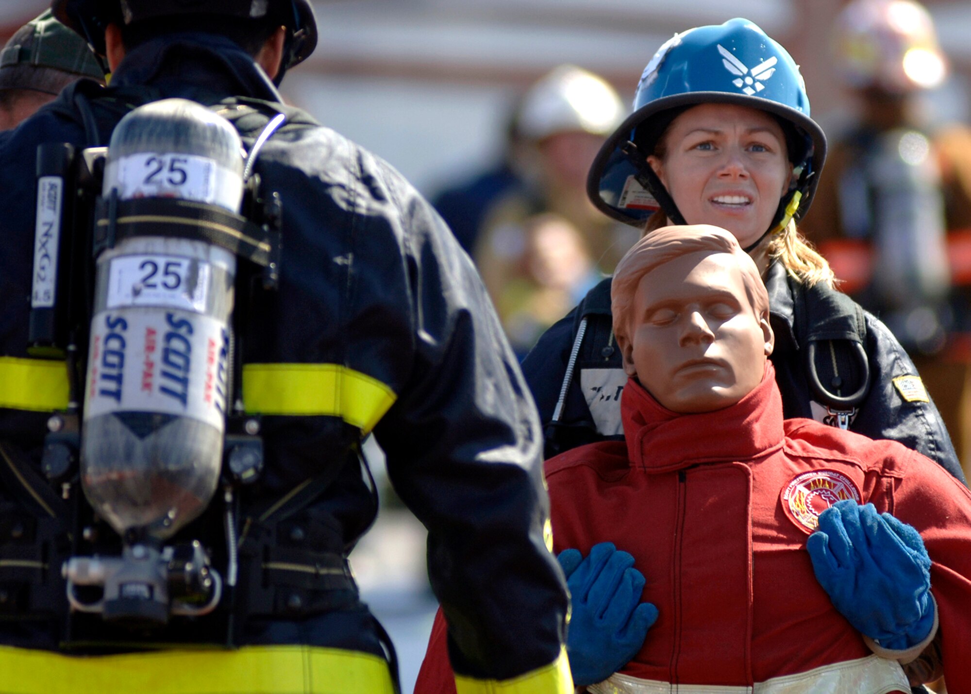 Shenah Groom, Team Travis, carries a 175-pound dummy to the finish line of the tandem portion of the Firefighter Combat Competition at Morrow, Ga., Oct. 13, 2006.  The competition is a national competition with over 450 firefighters from around the U.S.  (U.S. Air Force photo/Tech. Sgt. Cecilio M. Ricardo Jr.)
