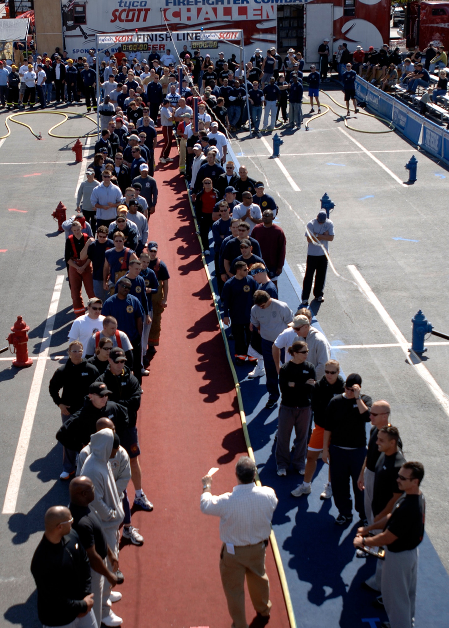 Participants line up for the opening ceremony during the second day of the Firefighter Combat Competition at Morrow, Ga., Oct. 13, 2006.  It is a national competition with over 450 firefighters from around the U.S.  (U.S. Air Force photo/Tech. Sgt. Cecilio M. Ricardo Jr.)