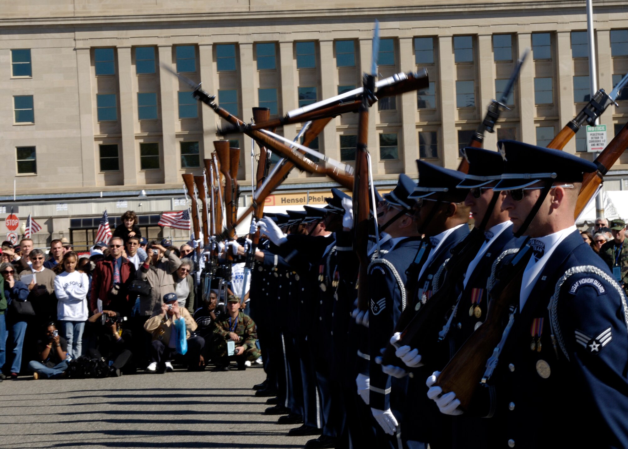 Members of the United States Air Force Drill Team perform during the Air Force open house at the Pentagon on Saturday, Oct. 14, 2006. The open house is running in conjunction with the official ceremony to dedicate the Air Force Memorial. President George W. Bush will join Senior Defense Dept. and Air Force officials in a ceremony to present the memorial to the Nation. Desiged by the late James Ingo Freed the memorial with its three soaring spires inspired by the U.S. Air Force Thunderbirds bomb burst manuever, pays tribute to and honors the patriotic men and women of the U.S. Air Force and its predeccessor organizations. An open house will run near the Pentagon in conjunction with the dedication ceremony which will feature performances by the U.S. Air Force Band, the U.S. Air Force Honor Guard drill team, and will culminate with a concert featuring country music performer LeeAnn Womack. (U.S. Air Force photo/Tech. Sgt. Rebecca F. Corey) 