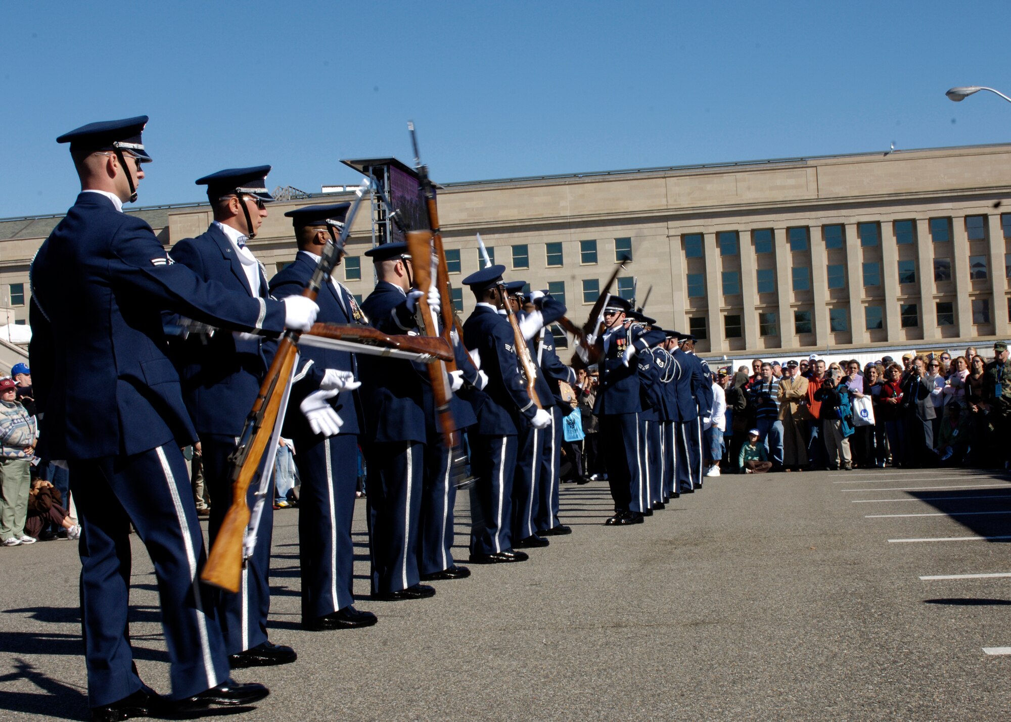 Members of the United States Air Force Drill Team perform during the Air Force open house at the Pentagon on Saturday, Oct. 14, 2006. The open house is running in conjunction with the official ceremony to dedicate the Air Force Memorial. President George W. Bush will join Senior Defense Dept. and Air Force officials in a ceremony to present the memorial to the Nation. Desiged by the late James Ingo Freed the memorial with its three soaring spires inspired by the U.S. Air Force Thunderbirds bomb burst manuever, pays tribute to and honors the patriotic men and women of the U.S. Air Force and its predeccessor organizations. An open house will run near the Pentagon in conjunction with the dedication ceremony which will feature performances by the U.S. Air Force Band, the U.S. Air Force Honor Guard drill team, and will culminate with a concert featuring country music performer LeeAnn Womack. (U.S. Air Force photo/Tech. Sgt. Rebecca F. Corey) 