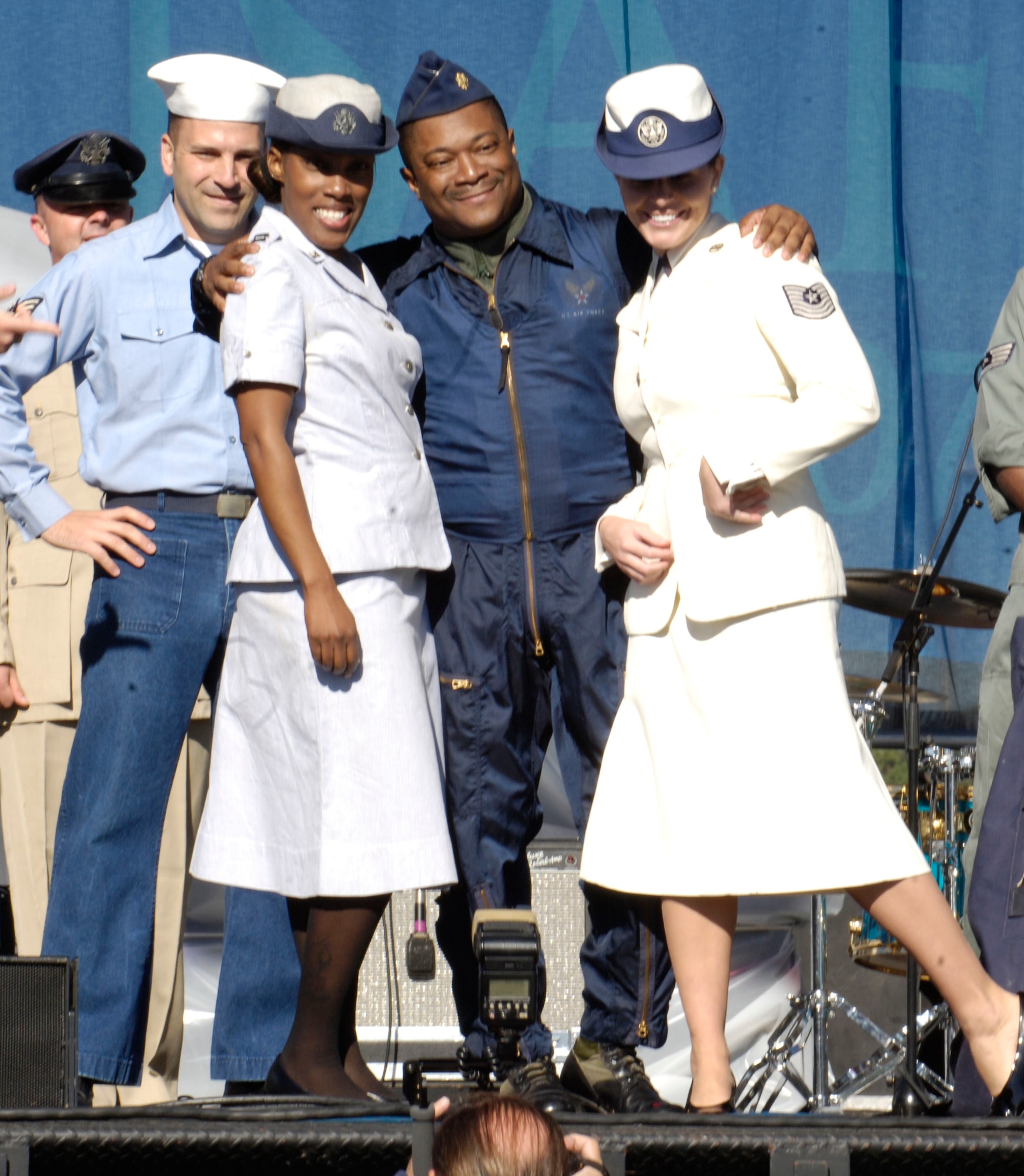 Current and former members of the United States Air Force and its predecessor organizations present a parade of uniforms at an Air Force open house at the Pentagon on Saturday, Oct. 14, 2006. The open house is running in conjunction with the official ceremony to dedicate the Air Force Memorial. President George W. Bush will join Senior Defense Dept. and Air Force officials in a ceremony to present the memorial to the Nation. Designed by the late James Ingo Freed the memorial with its three soaring spires inspired by the U.S. Air Force Thunderbirds bomb burst manuever, pays tribute to and honors the patriotic men and women of the U.S. Air Force and its predeccessor organizations. An open house will run near the Pentagon in conjunction with the dedication ceremony which will feature performances by the U.S. Air Force Band, the U.S. Air Force Honor Guard drill team, and will culminate with a concert featuring country music performer LeeAnn Womack. (U.S. Air Force photo/Senior Airman Desiree L. Andrejcik)