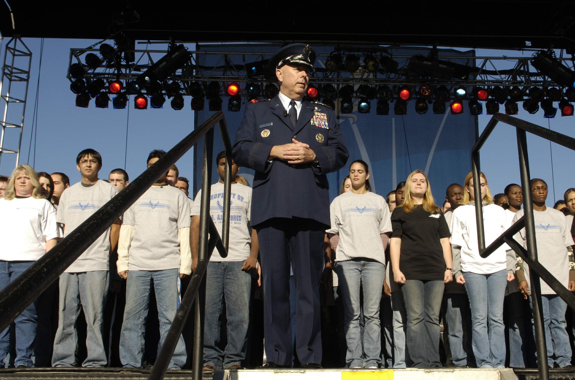 Air Force Chief of Staff Gen. T. Michael Moseley welcomes 90 young men and women into the U.S. Air Force on Saturday, Oct. 14, 2006, during open house activities at the Pentagon prior to the official dedication ceremony of the Air Force Memorial. President George W. Bush will join Senior Defense Dept. and Air Force officials in a ceremony to present the memorial to the Nation. Desiged by the late James Ingo Freed the memorial with its three soaring spires inspired by the U.S. Air Force Thunderbirds bomb burst manuever, pays tribute to and honors the patriotic men and women of the U.S. Air Force and its predeccessor organizations. An open house will run near the Pentagon in conjunction with the dedication ceremony which will feature performances by the U.S. Air Force Band, the U.S. Air Force Honor Guard drill team, and will culminate with a concert featuring country music performer LeeAnn Womack. (U.S. Air Force photo/Airman 1st Class Rusti M. Caraker) 
