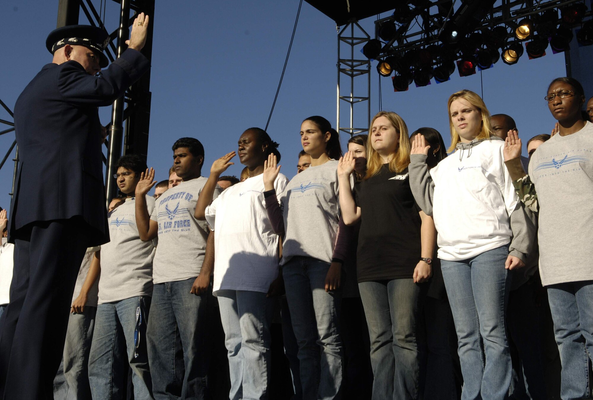 Air Force Chief of Staff Gen. T. Michael Moseley inducts  90 young men and women into the U.S. Air Force on Saturday, Oct. 14, 2006, during open house activities at the Pentagon prior to the official dedication ceremony of the Air Force Memorial. President George W. Bush will join Senior Defense Dept. and Air Force officials in a ceremony to present the memorial to the Nation. Desiged by the late James Ingo Freed the memorial with its three soaring spires inspired by the U.S. Air Force Thunderbirds bomb burst manuever, pays tribute to and honors the patriotic men and women of the U.S. Air Force and its predeccessor organizations. An open house will run near the Pentagon in conjunction with the dedication ceremony which will feature performances by the U.S. Air Force Band, the U.S. Air Force Honor Guard drill team, and will culminate with a concert featuring country music performer LeeAnn Womack. (U.S. Air Force photo/Airman 1st Class Rusti M. Caraker) 