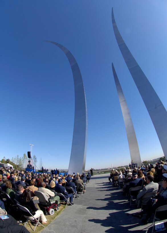 Hundreds gathered at the base of the new Air Force Memorial  as Secretary of the Air Force Michael W. Wynne officially closed the Air Force Memorial commemoration with a wreath laying ceremony in Arlington, Va., Oct. 15, 2006. Looking on are, from left: Chief Master Sgt. of the Air Force Rodney J. McKinley, Air Force Memorial Foundation Chairman Ross Perot Jr. , and Air Force Chief of Staff Gen. T. Michael Moseley.  On behalf of all American citizens President George W. Bush accepted the Air Force Memorial from Air Force Memorial Foundation Chairman Ross Perot Jr. during the previous day's dedication ceremony at the base of the Air Force Memorial that overlooks the Pentagon.  Designed by the late James Ingo Freed the memorial with its three soaring spires inspired by the U.S. Air Force Thunderbirds bomb burst manuever, pays tribute to and honors the patriotic men and women of the U.S. Air Force and its predeccessor organizations. An open house was held near the Pentagon in conjunction with the dedication ceremony which featured performances by the U.S. Air Force Band, the U.S. Air Force Honor Guard drill team, and culminated with a concert featuring country music performer LeeAnn Womack. (U.S. Air Force photo/Tech. Sgt. Cohen Young) 