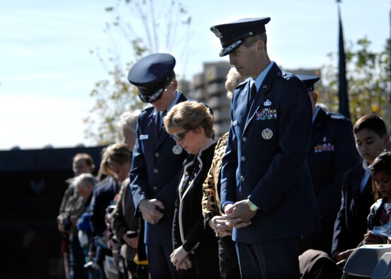 Heads are bowed and hands are crossed during the opening prayer of the Wreath Ceremony held at the base of the new Air Force Memorial in Arlington, Va., Oct. 15, 2006. Secretary of the Air Force Michael W. Wynne officially closed the Air Force Memorial commemoration by leading the wreath laying ceremony.  (U.S. Air Force photo/Tech. Sgt. Cohen Young) 