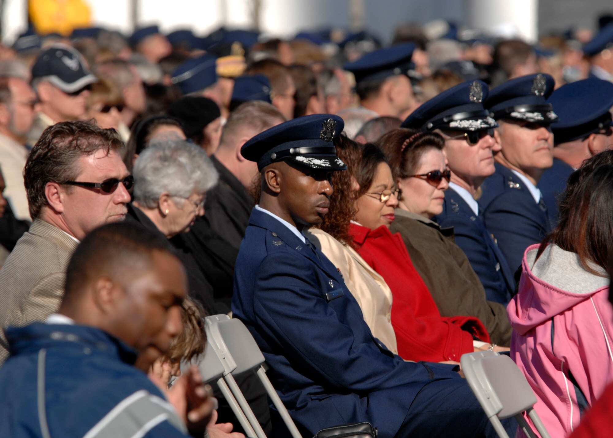 Hundreds gathered at the base of the new Air Force Memorial as Secretary of the Air Force Michael W. Wynne officially closed the Air Force Memorial commemoration with a wreath laying ceremony in Arlington, Va., Oct. 15, 2006. On behalf of all American citizens President George W. Bush accepted the Air Force Memorial from Air Force Memorial Foundation Chairman Ross Perot Jr. during the previous day's dedication ceremony at the base of the Air Force Memorial that overlooks the Pentagon.  Designed by the late James Ingo Freed the memorial with its three soaring spires inspired by the U.S. Air Force Thunderbirds bomb burst manuever, pays tribute to and honors the patriotic men and women of the U.S. Air Force and its predeccessor organizations. An open house was held near the Pentagon in conjunction with the dedication ceremony which featured performances by the U.S. Air Force Band, the U.S. Air Force Honor Guard drill team, and culminated with a concert featuring country music performer LeeAnn Womack. (U.S. Air Force photo/Tech. Sgt. Cohen Young) 