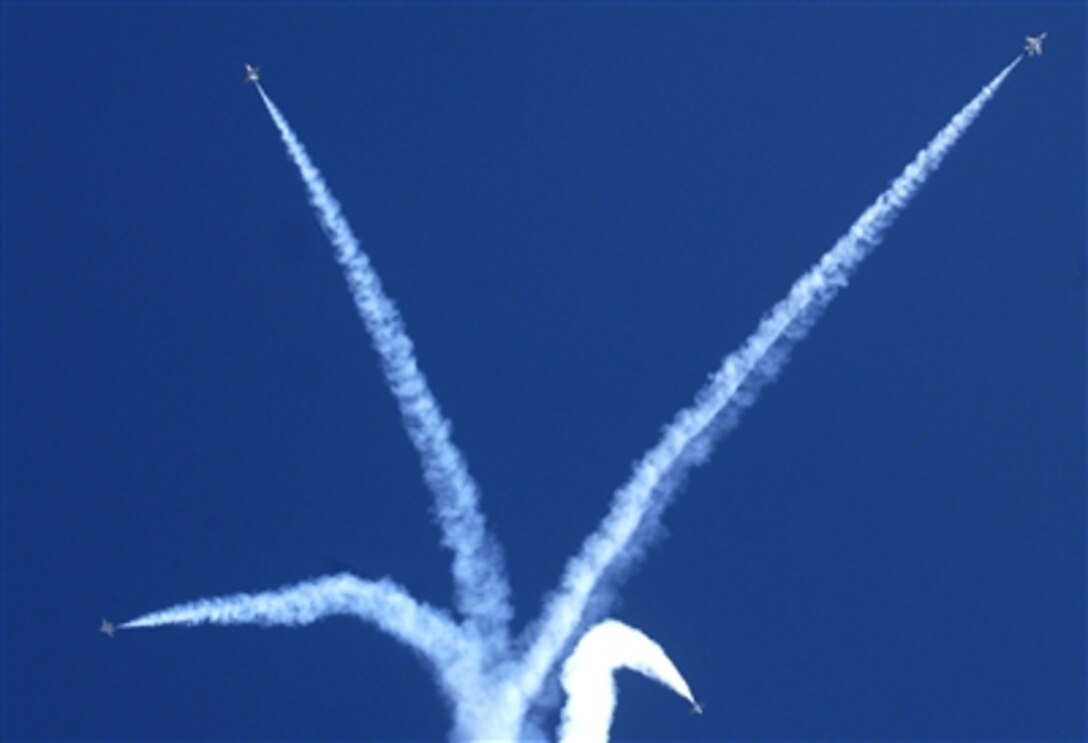 U.S. Air Force F-16 aircraft from the Air Force Air Demonstration Squadron Thunderbirds perform during the conclusion of the dedication ceremony for the new Air Force Memorial at Arlington, Va., Oct. 14, 2006.