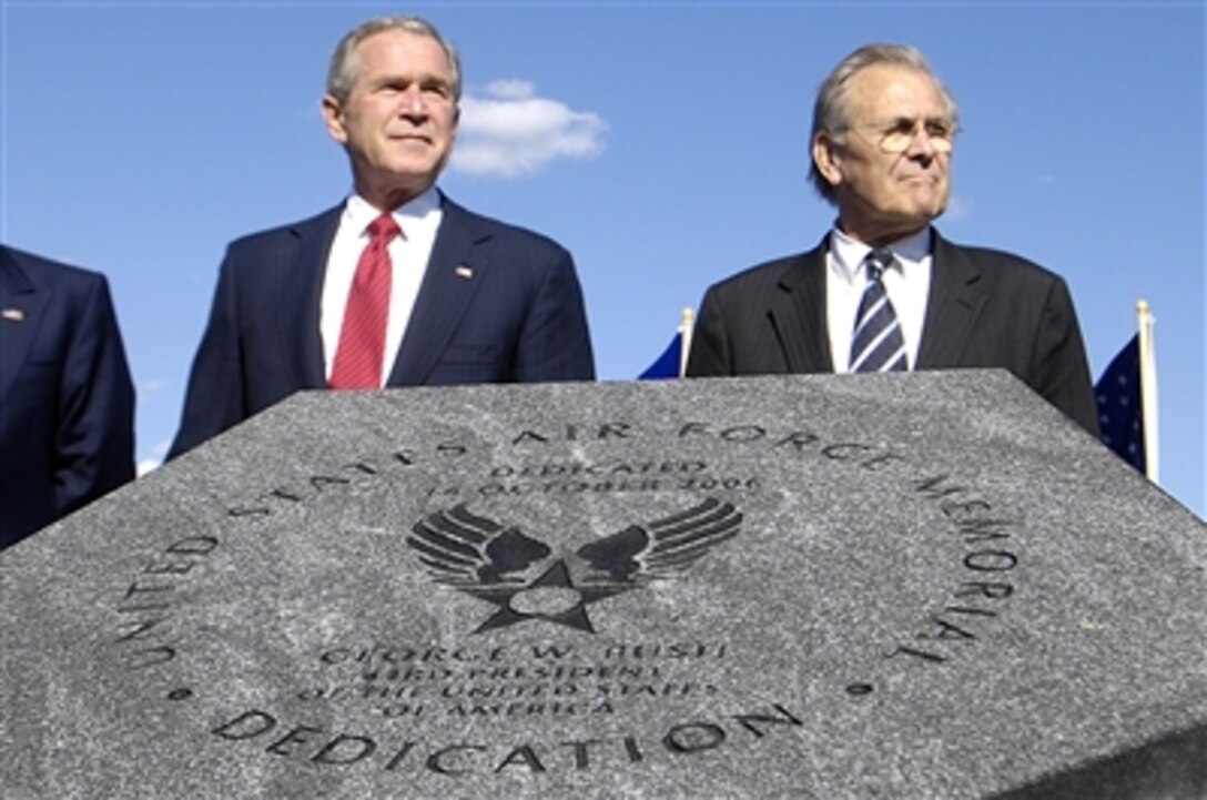President George W. Bush and Secretary of Defense Donald H. Rumsfeld observe the new Air Force Memorial plaque after it was uncovered during the U.S. Air Force Memorial dedication ceremony in Arlington, Va., Oct. 14, 2006.