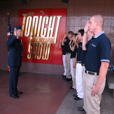 Seven Southern California residents joined the Air Force Reserve on Tuesday before the taping of The Tonight Show with Jay Leno during the command's yearly accessions' week program.  Each October, Air Force Reserve Command recruiting asks its wings to perform a mass enlistment ceremony at some unique location.  This year, the newest recruits were enlisted at NBC in Burbank, Calif.  The Tonight Show guests featured professional golfer Tiger Woods, Chef Emeril Lagasse and rapper Chingy. (U.S. Air Force photo by Maj Don Traud, 452 AMW/PA)