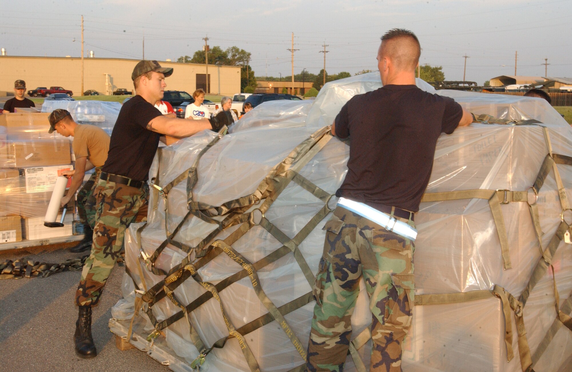 Airmen from the 97th Logistics Readiness Squadron at Altus Air Force Base, Okla., prepare supplies donated by the community to be flown to regions devastated by Hurricane Katrina. (Photo by Master Sgt. Eugene Bird)