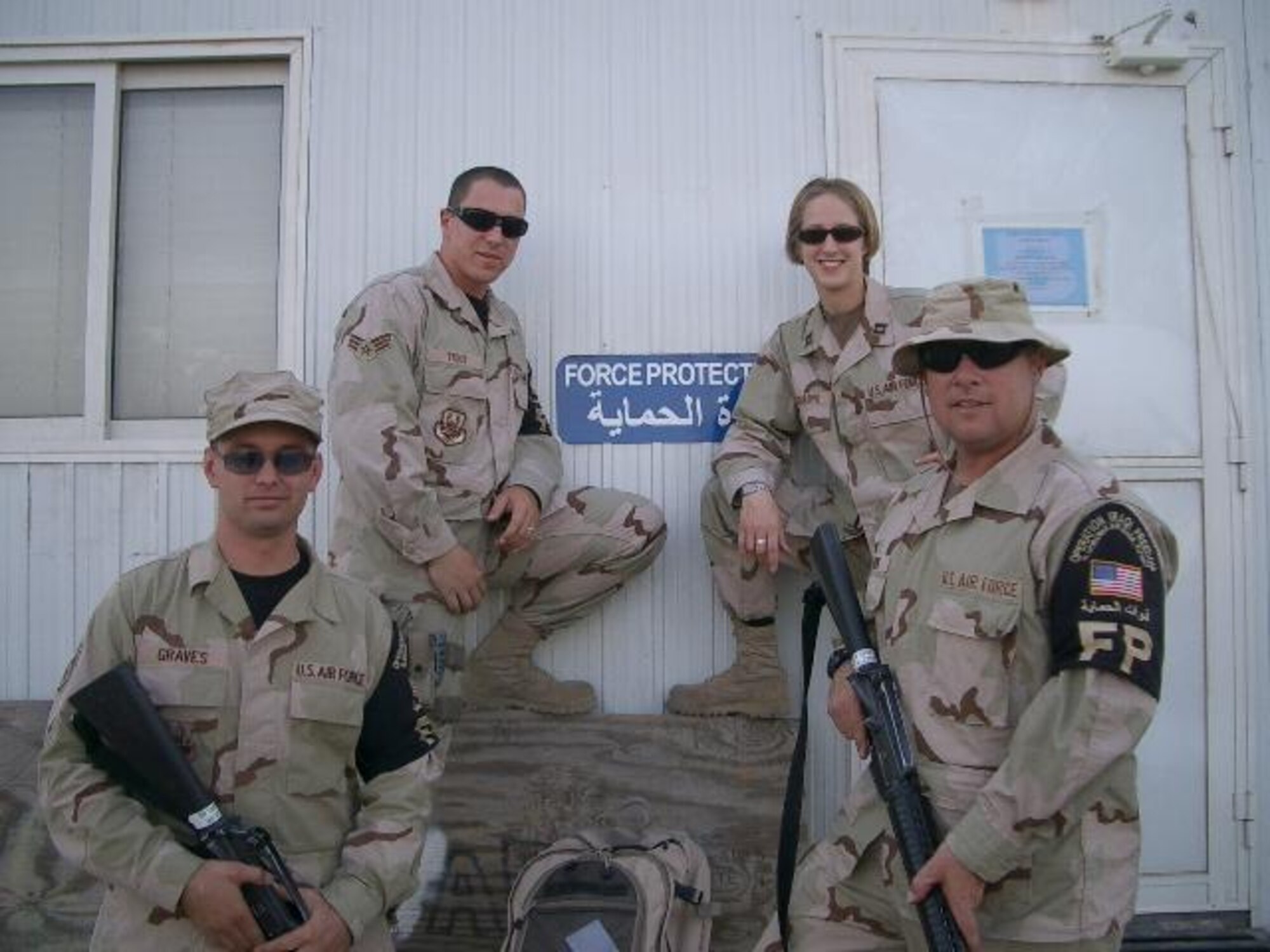 Senior Airman Shane Trout (back left) poses with other deployed Air Force members recently.  Airman Trout is deployed to Abdullah Al Mubarak Air Base, Kuwait, in support of aerial portal operations on Kuwait City International Airport.  He's deployed out of the 90th Missile Maintenance Squadron to the 5th Expeditionary Air Mobility Squadron.