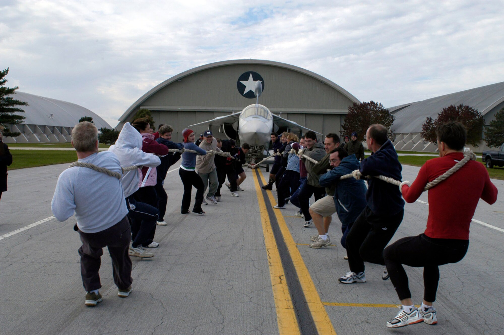 A team begins to pull a 60,000 pound EF-111 Raven during the 2006 CFC Aircraft Pull Oct. 12 at the National Museum of the U.S. Air Force at Wright-Patterson Air Force Base, Ohio.  Teams pull the aircraft as far as they can in 45 seconds.  The team pulling the aircraft the greatest distance is the winner.  Team entry fees are donated to the CFC.  (U.S. Air Force photo)