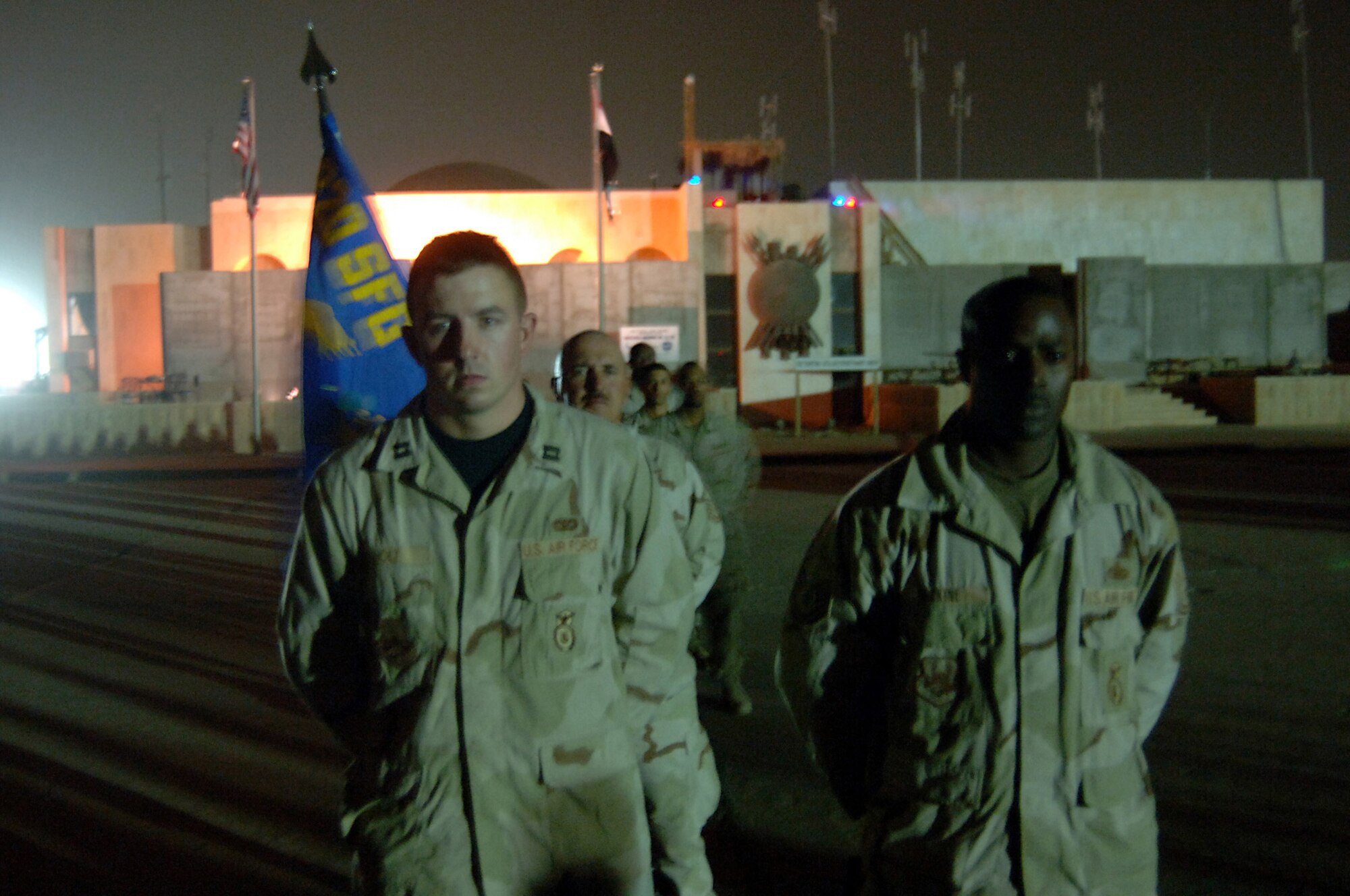 Members of the 732nd Expeditionary Security Forces Squadron stand in formation at the patriation ceremony for Airman 1st Class Leebernard E. Chavis here Oct. 15. Airman Chavis, deployed to the 732nd ESFS was killed Oct. 14 while performing duties as a member of a U.S. military police training team supporting Iraqi police. (Air Force photo/Staff Sgt. Scott McNabb)