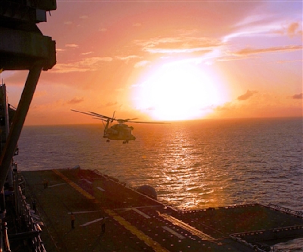 A Marine pilot with Marine Medium Helicopter Squadron 265, 31st Marine Expeditionary Unit's aviation combat element, prepares to land a CH-53E Super Stallion helicopter on the flight deck of the USS Essex, Oct. 10, 2006, during an amphibious ready group exercise. 