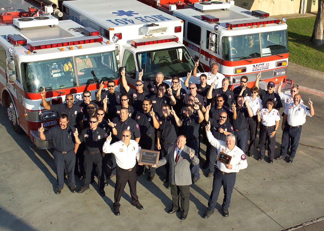 Employees of F&ESD display their exuberance outside of the Nebo Annex Fire Station after being named the Marine Corps' Fire Department of the Year.