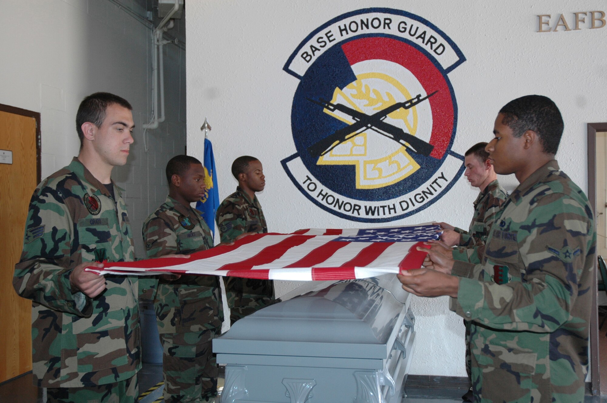 Ellsworth Honor Guard members practice to perfect ceremonial flag folding they will perform during funeral services. 