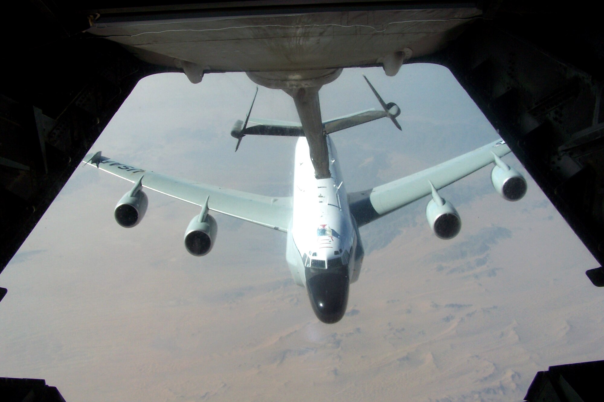 An RC-135 Rivet Joint aircraft pulls up to the boom of a KC-10 Extender during an air refueling mission Oct. 17 over Southwest Asia. Aircraft from the 908th Expeditionary Air Refueling Squadron, including the KC-10 and KC-135 Stratotanker, provide fuel for coalition aircraft missions for Operations Iraqi Freedom and Enduring Freedom. The squadron is attached to the 380th Air Expeditionary Wing, the largest air refueling wing in Southwest Asia. (U.S. Air Force photo/Senior Airman Matt Craig) 
