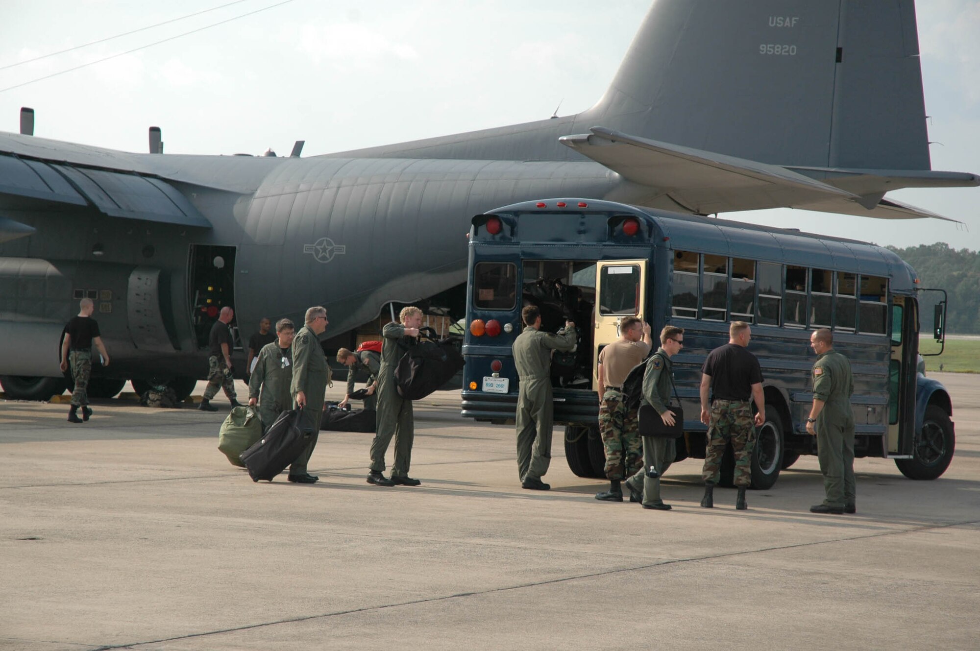 Airmen from the 16th Special Operations Wing from Hurlburt Field, Fla., load onto a bus after landing at Little Rock AFB, Ark.,  Aug. 28. Several Airmen and C-21’s from the 81st Training Wing at Keesler AFB, Miss. and C-130’s from the 16th SOW at Hurlburt Field sought refuge at Little Rock as Hurricane Katrina inched its way toward the coast. (Photo by 1st Lt. Jon Quinlan)