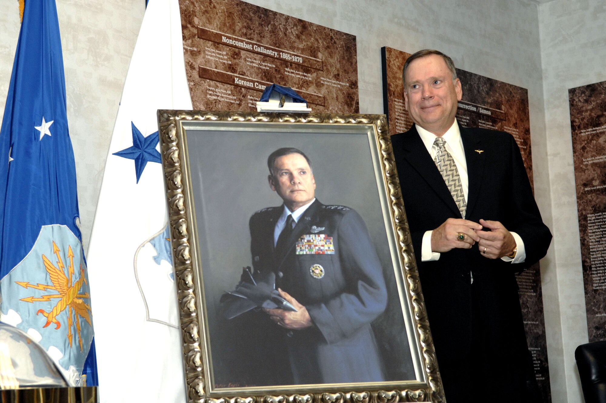 Retired Air Force Chief of Staff Gen. John P. Jumper stands next to his portrait in the Hall of Heroes at the Pentagon Oct. 16. (U.S. Air Force photo/Tech. Sgt. Cohen Young)