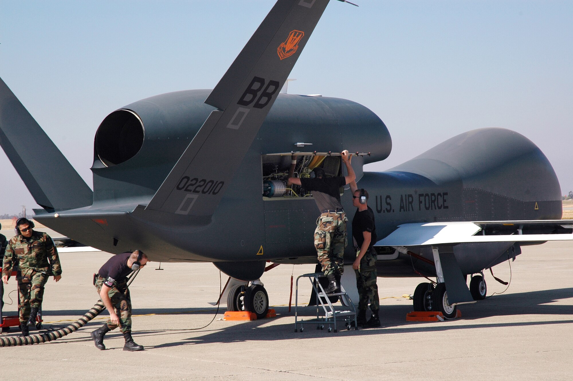 Avionics specialists with the 12th Aircraft Maintenance Unit prepare the Global Hawk for a runway taxi test Oct. 13, 2006 at Beale Air Force Base, Calif.  The Global Hawk is scheduled to begin flying at Beale in early November. The program is a total force effort with the Air Force Reserve's 13th Reconnaissance Squadron assisting active duty personnel. (U.S. Air Force photo/Stacey Knott) 