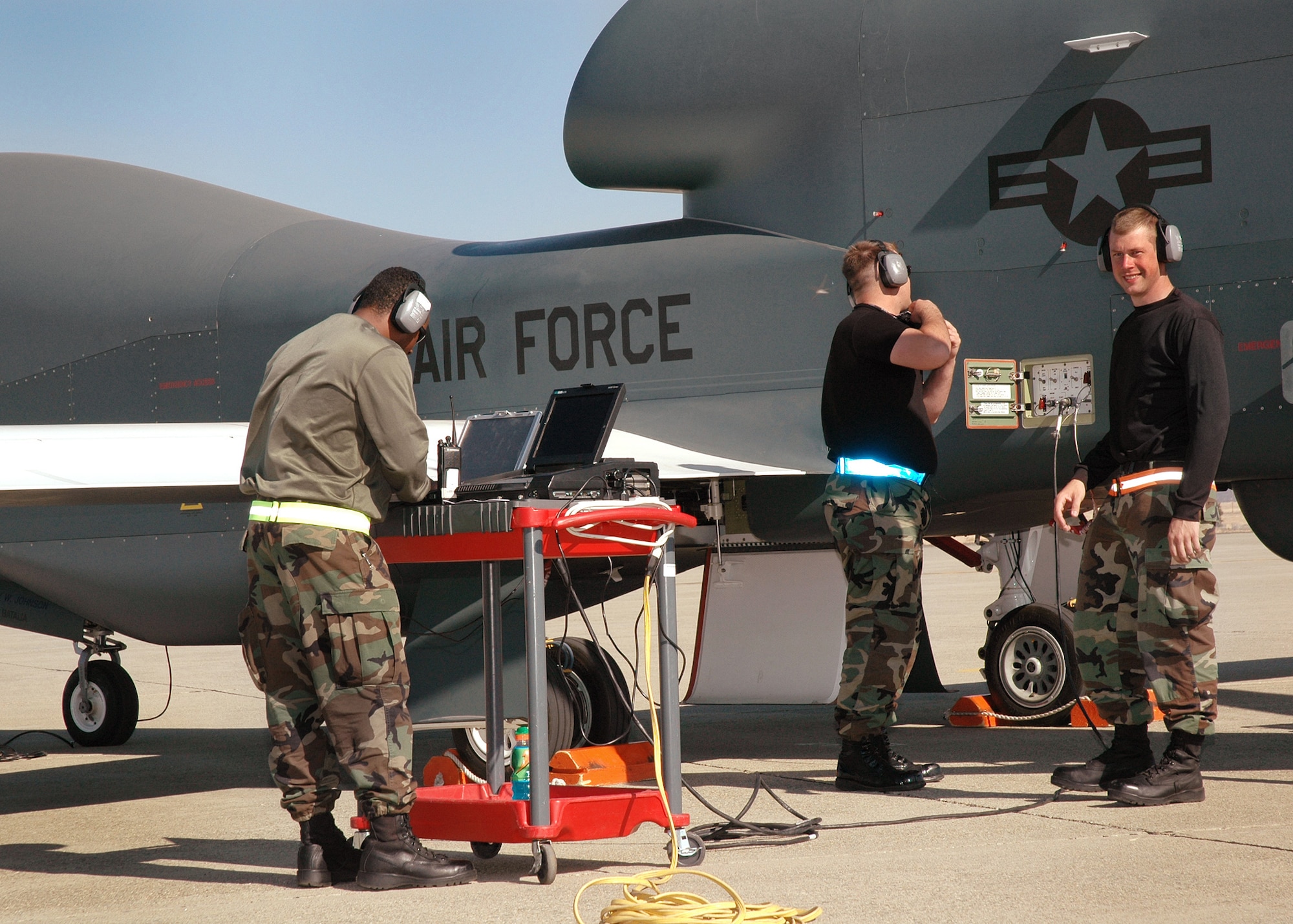 Staff Sgt. Shareem Jones, Staff Sgt. Michael Kaffenberger, and Airman 1st Class Brian Hill, 12th Aircraft Maintenance Unit avionics specialists, prepare the Global Hawk for a runway taxi test Oct. 13, 2006 at Beale Air Force Base, Calif.  The Global Hawk is scheduled to begin flying at Beale in early November. The program is a total force effort with the Air Force Reserve's 13th Reconnaissance Squadron assisting active duty personnel. (U.S. Air Force photo/Stacey Knott) 