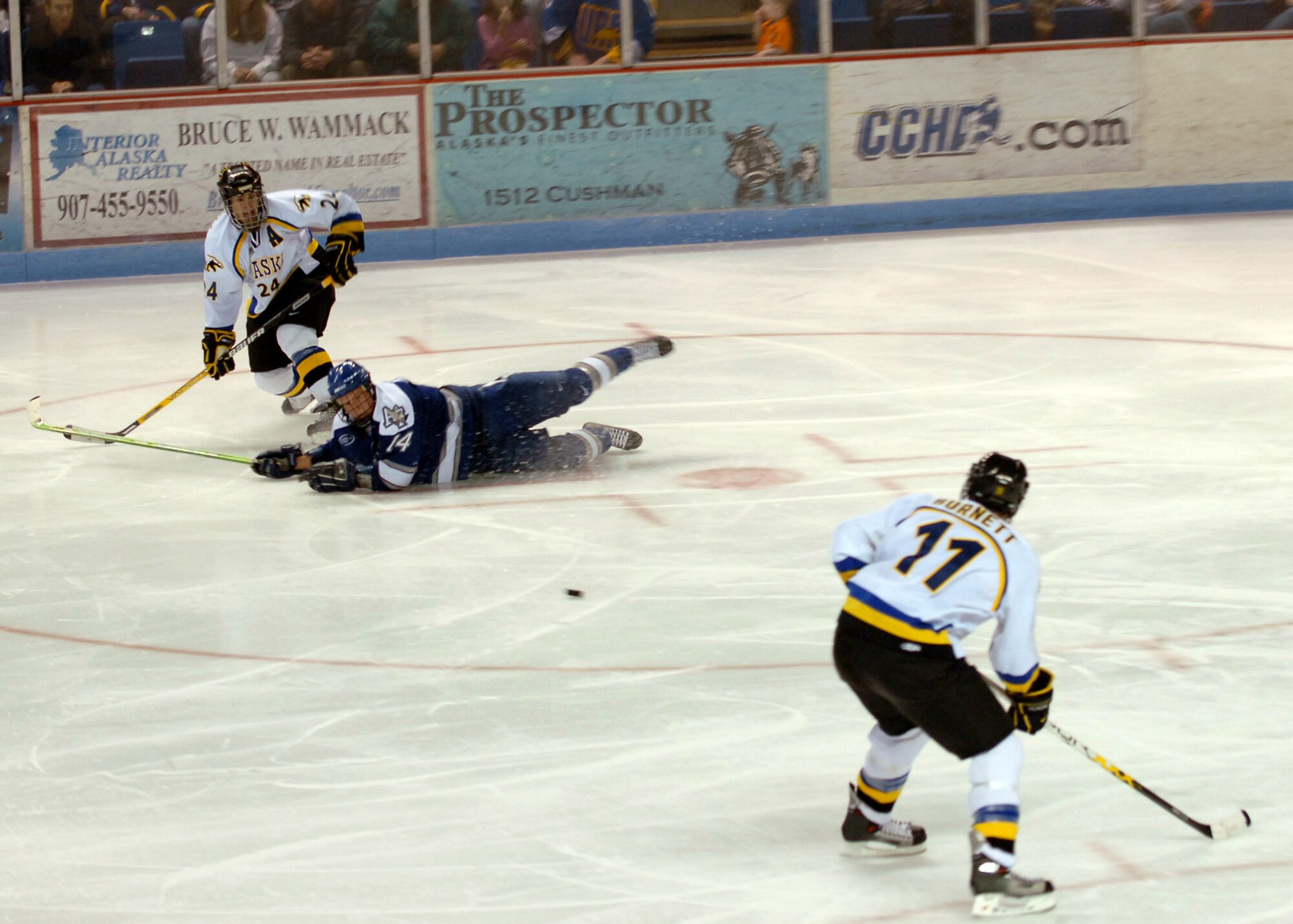 Cadet 3rd Class Michael Mayra of the U.S. Air Force Academy Falcons tries to block the shot as T.J. Campbell of the University of Alaska-Fairbanks Nanooks passes to Lucas Burnett during a match at the Carlson Center downtown Fairbanks on Oct. 14. The Nanooks went on to win the game 8 to 4.  The Falcons fell to 1-3 for the season.  (U.S. Air Force photo/Airman Jonathan Snyder)