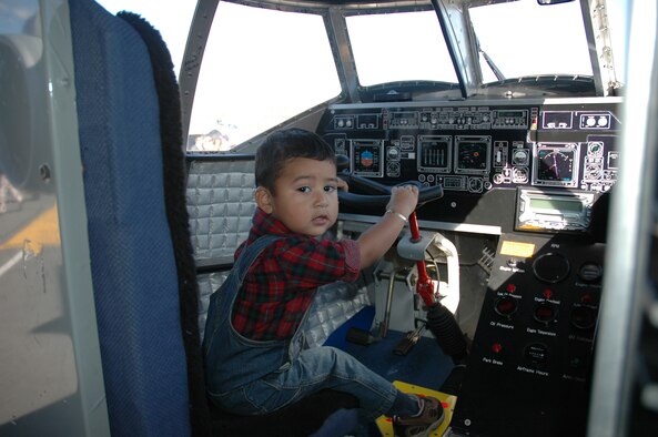 Future Air Force pilot sits in the cockpit of the Mini C-17 on display at the Pentagon for a Memorial Dedication and Open House. (Photo by Debra Baldwin)