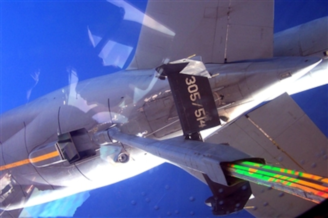 A KC-10 Extender connects to a second KC-10, Oct. 17, 2006, over Iraq. The refueling maneuver allowed the connecting KC-10 from the 380th Air Expeditionary Wing to offload more fuel for coalition aircraft missions in the area. A KC-10 can carry as much as 55,385 gallons of fuel. 