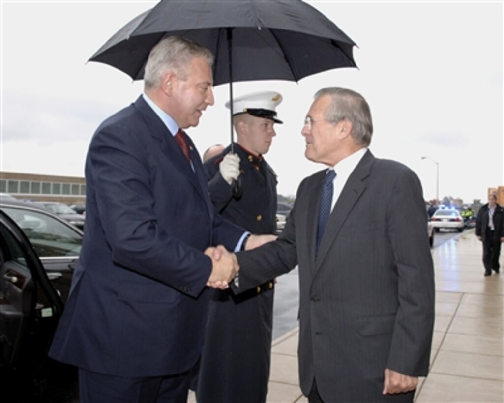 Secretary of Defense Donald H. Rumsfeld (right) welcomes Croatian Prime Minister Ivo Sanader (left) to the Pentagon on Oct. 17, 2006.  Rumsfeld and Sanader will meet to discuss defense issues of mutual interest.  