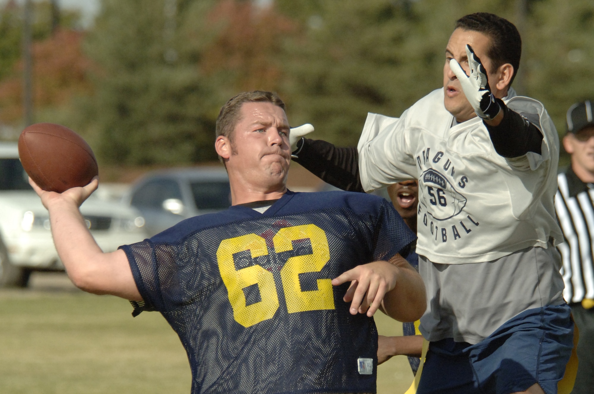 FAIRCHILD AIR FORCE BASE, Wash. -- Master Sgt. Kyle Campbell, 92nd Security Forces Squadron NCO in charge of operations support, attempts to block a pass by Mike Carr, Spokane Police Department. The 92nd SFS emerged victorious Oct. 13, defeating the team of off-base law enforcement by a score of 14-12. With no time left on the clock, the off-base cops failed to tie the game with a two-point conversion on the last play. This was the first year for a football match-up pitting Security Forces against their off-base counterparts. The idea, event organizers said, was to enhance camaraderie between the organizations and build on their already positive relationship. (U.S. Air Force photo/Senior Airman Chad Watkins)