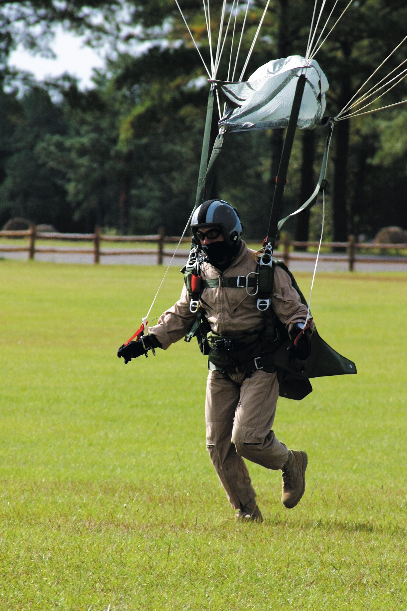 A combat controller from the 21st Special Tactics Squadron lands at Raeford Drop Zone after a HALO parachute jump Oct. 13. (U.S. Air Force photo/Senior Airman Stacia Zachary)
