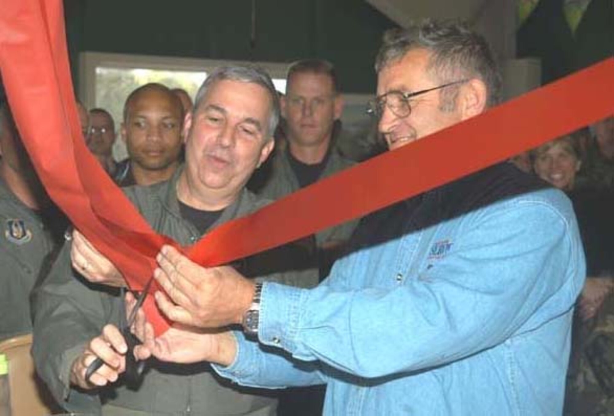 GRISSOM AIR RESERVE BASE, Ind --- Brig. Gen. Dean Despinoy, 434th Air Refueling Wing Commander, and Mr. Carl Wade, 434th Services Flight, cut the ribbon to mark the grand opening of the "Chocks" Community Center. "Chocks" will provide unit members with a place to relax and socialize during Unit Training Assemblies. (U.S. Force Photo/Senior Airman Robert Modelo)