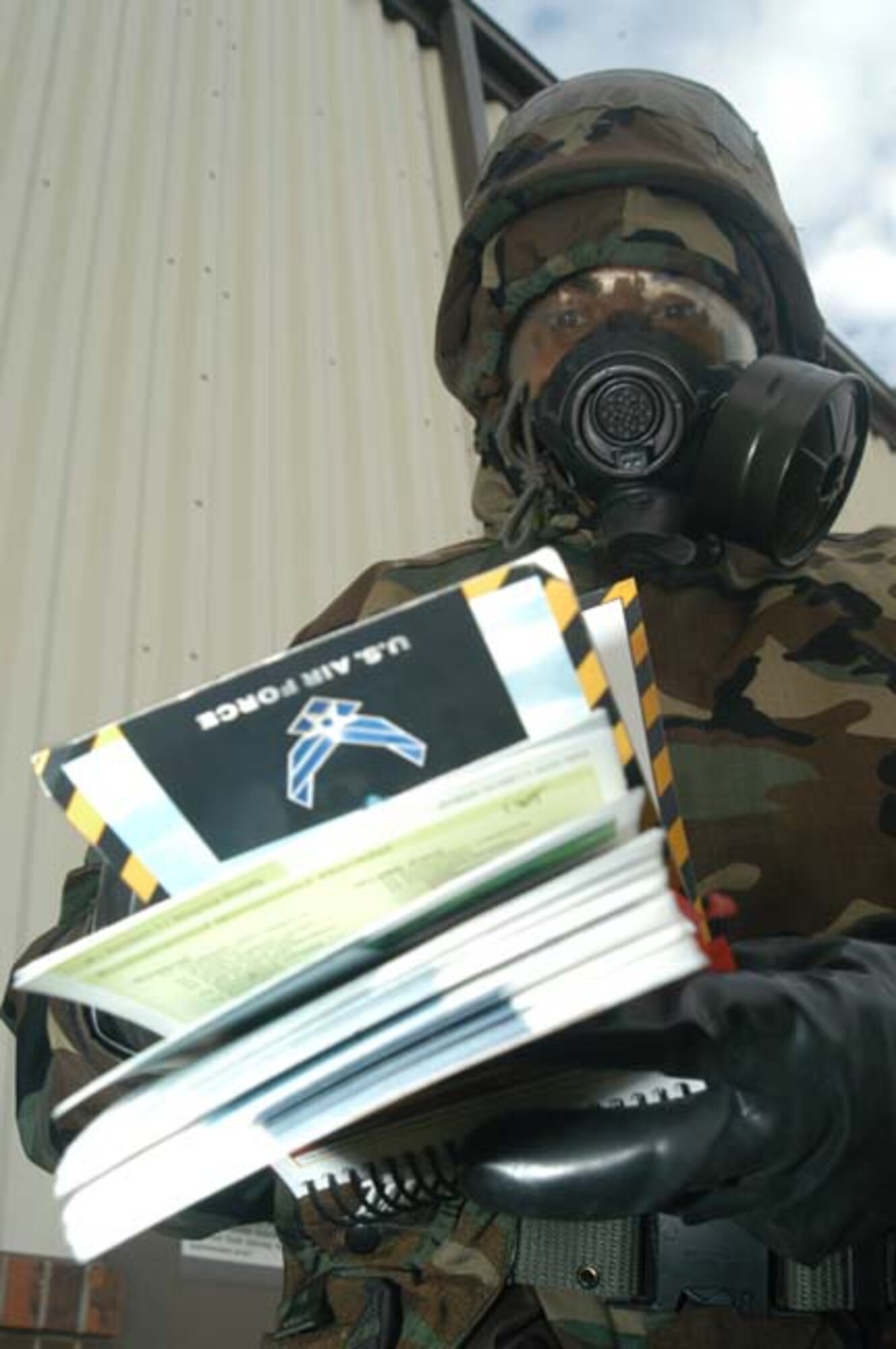 GRISSOM AIR RESERVE BASE, Ind --A member of the 434th Air Refueling Wing checks his Airman's Manual during a recent "Ability to Survive and Operate" exercise.  (U.S. Air Force Photo/Senior Airman Mark Orders-Woempner)