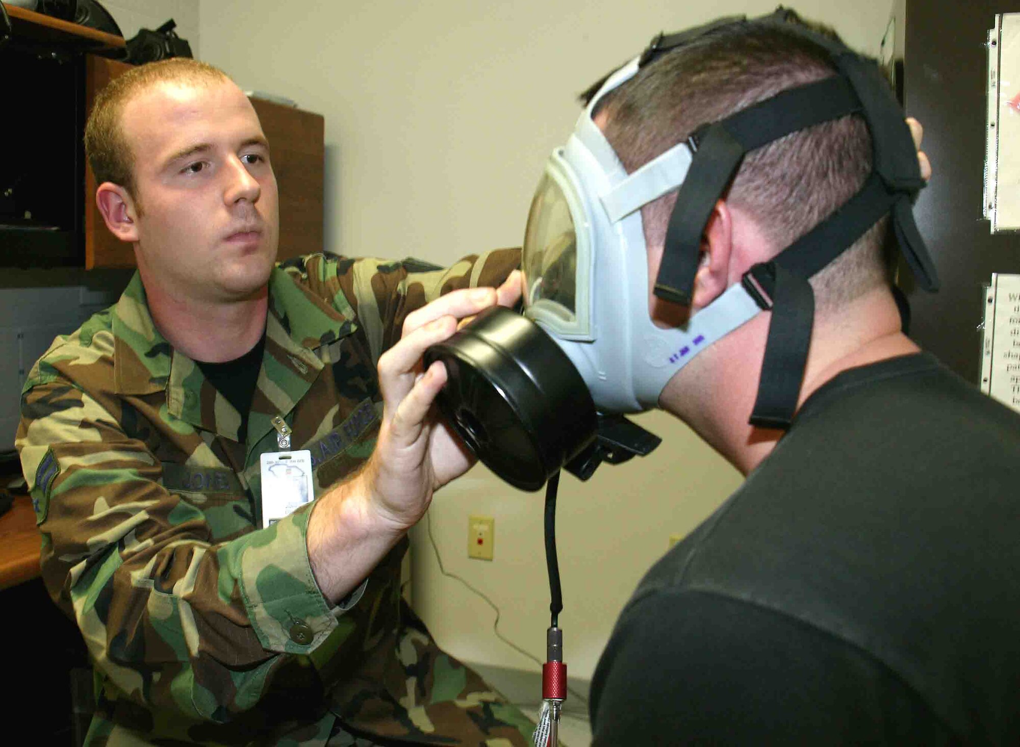 Airman 1st Class Dylan Jones, 20th Aeromedical-Dental Squadron bioenvironmental engineer, performs a gas mask fit test on an Airman Tuesday. (U.S. Air Force photo/Senior Airman John Gordinier)
