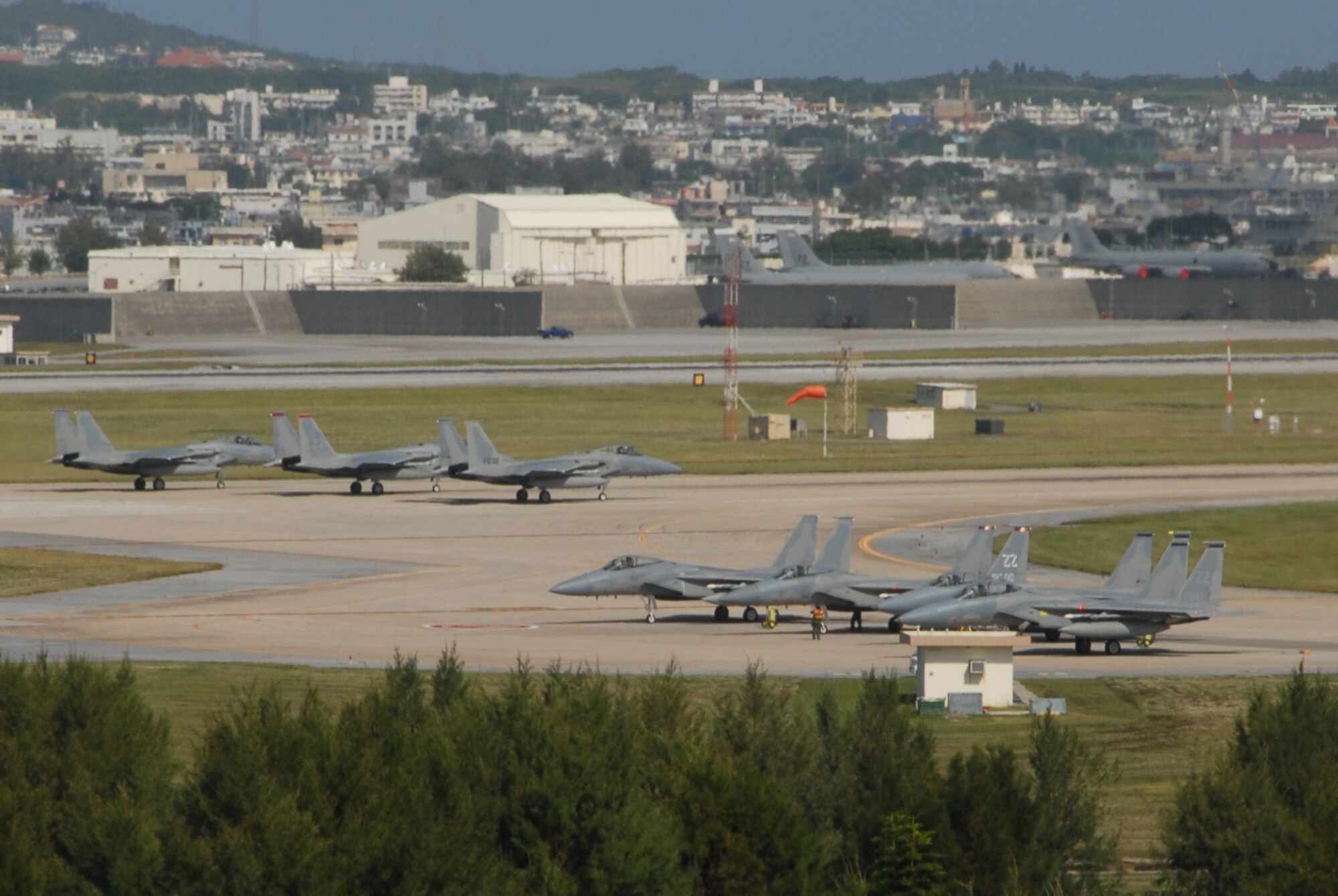 F-15 Eagles go through missile arming procedures and prepare to take off during a combat capability exercise Oct. 19 at Kadena Air Base, Japan. The 18th Wing exercise from Oct. 13 to 19 tested the wing's ability to respond to a wartime situation. (U.S. Air Force photo/Tech. Sgt. Dave DeRemer)
