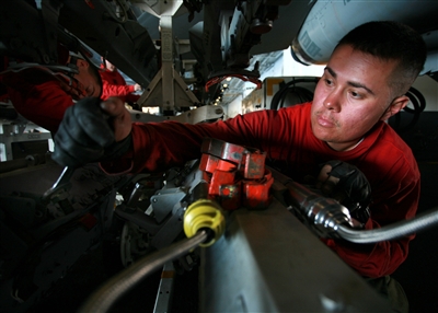 Petty Officer 2nd Class Nicolas Lamendola prepares a multiple-ejection ...