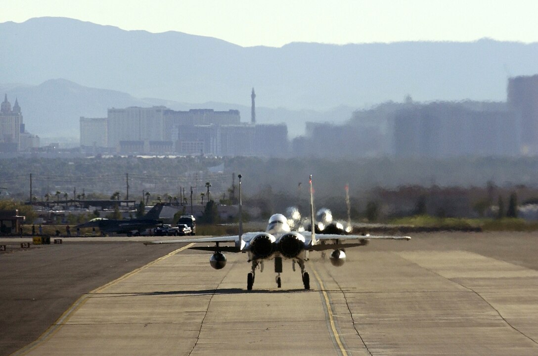F-15 Eagles taxi out Oct. 19 during Red Flag 07-1 at Nellis Air Force Base, Nev. Red Flag tests aircrews' warfighting skills in realistic combat situations. (U.S. Air Force photo/Master Sgt. Kevin J. Gruenwald)




