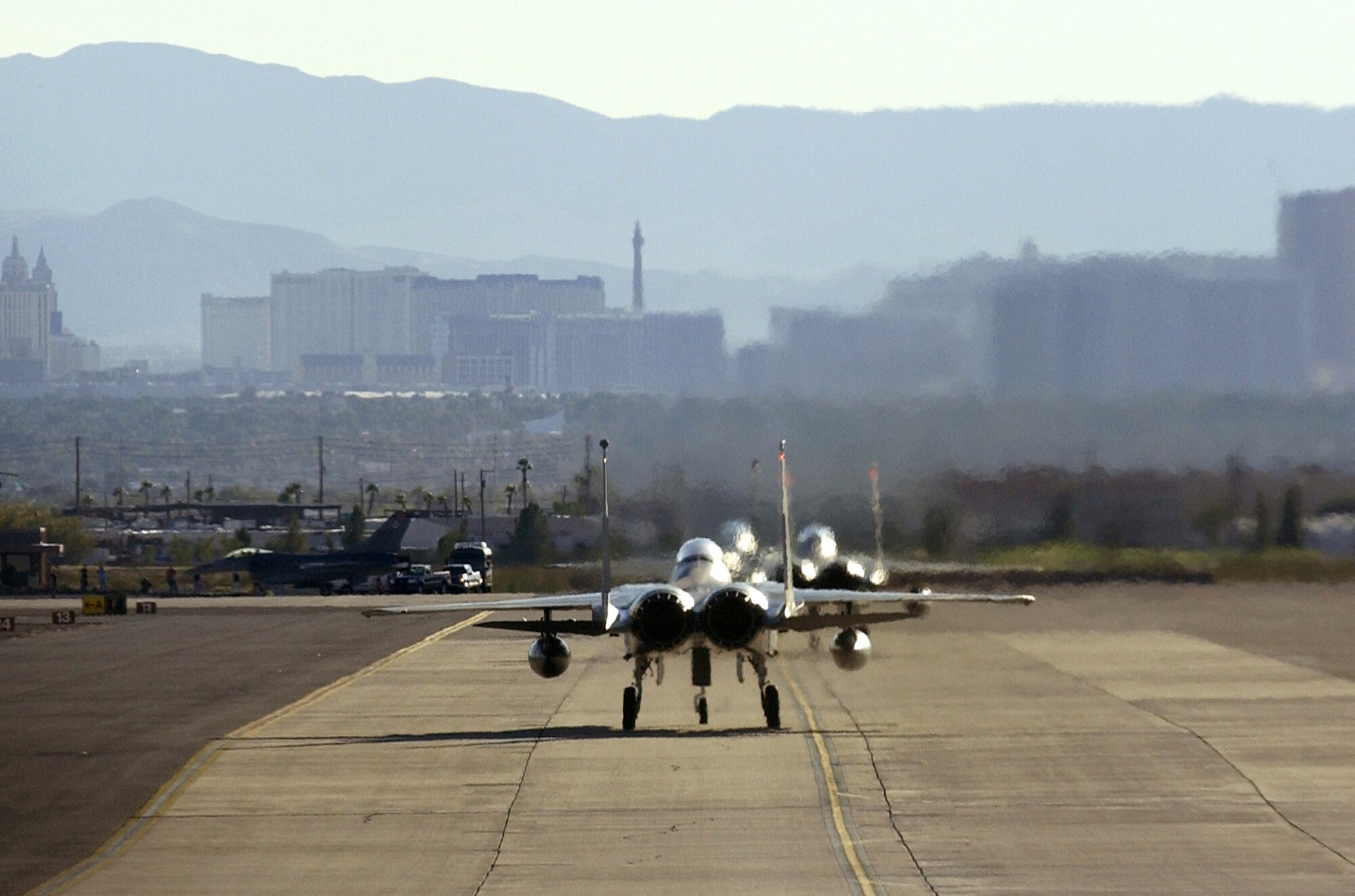 F-15 Eagles taxi out Oct. 19 during Red Flag 07-1 at Nellis Air Force Base, Nev. Red Flag tests aircrews' warfighting skills in realistic combat situations. (U.S. Air Force photo/Master Sgt. Kevin J. Gruenwald)




