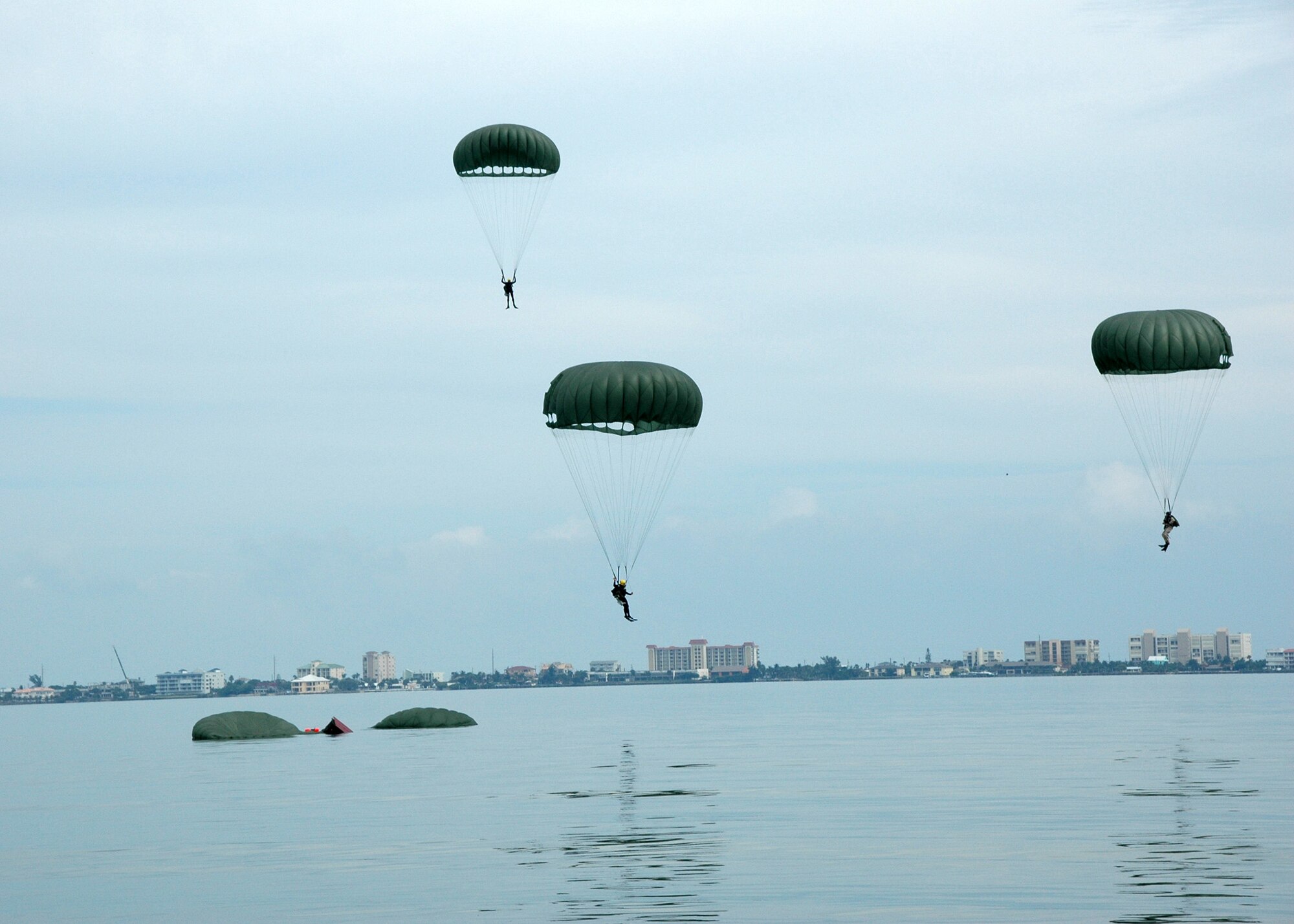 PJ trainees parachute into the Banana River.  (U.S. Air Force photo by Senior Airman Jonathan Simmons) (Released)