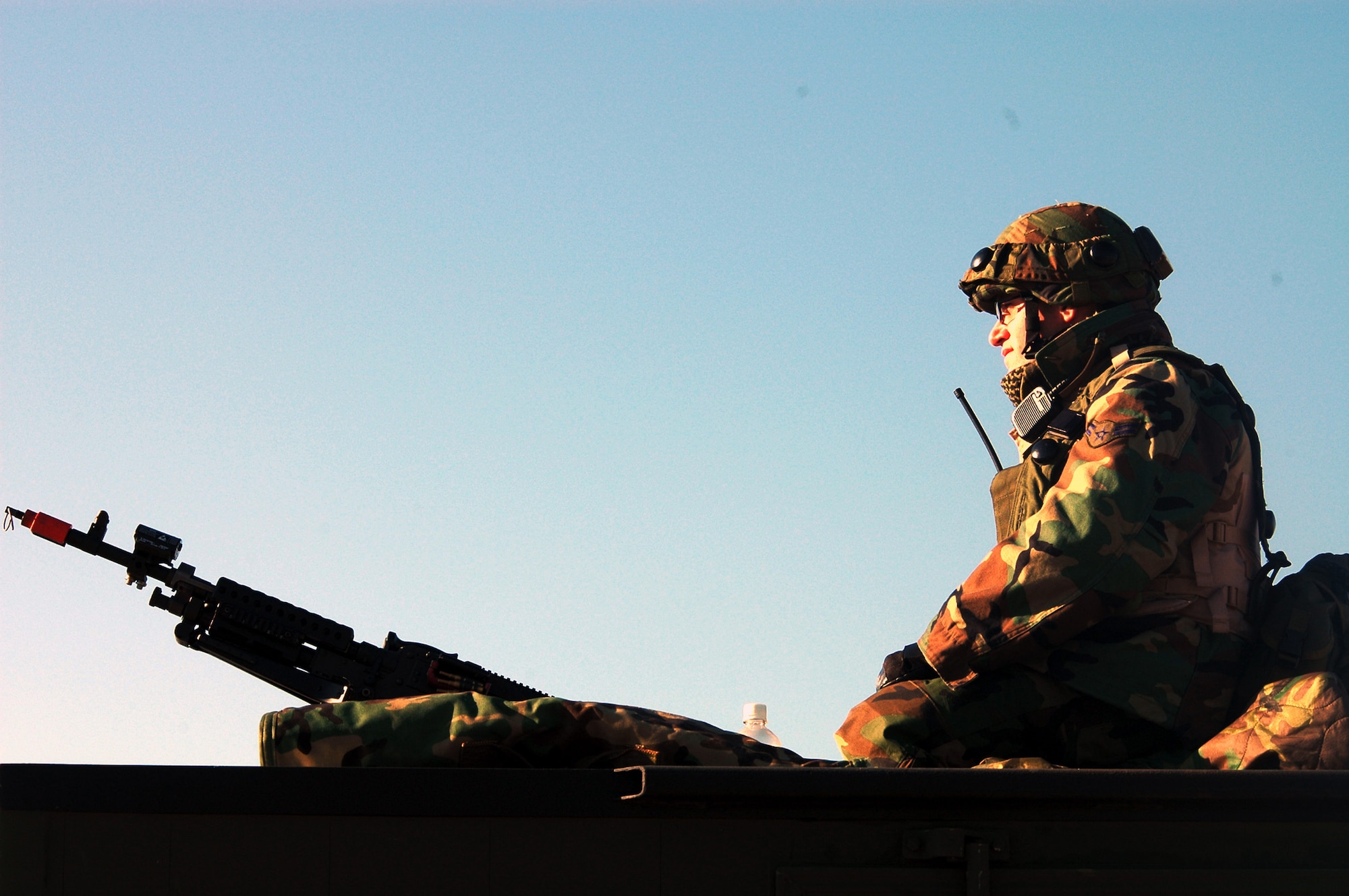 Airman 1st Class Kelly Gallahan watches over an entry control point with an M-4 machine gun Oct. 15 as part of operations for Air Force Exercise Eagle Flag 07-1 at Naval Air Engineering Station Lakehurst, N.J. More than 400 Airmen participated in the exercise as they prepare for upcoming deployments. Airman Gallahan is a security forces journeyman from the 817th Contingency Response Group at McGuire Air Force Base, N.J. (U.S. Air Force photo/Tech. Sgt. Scott T. Sturkol)