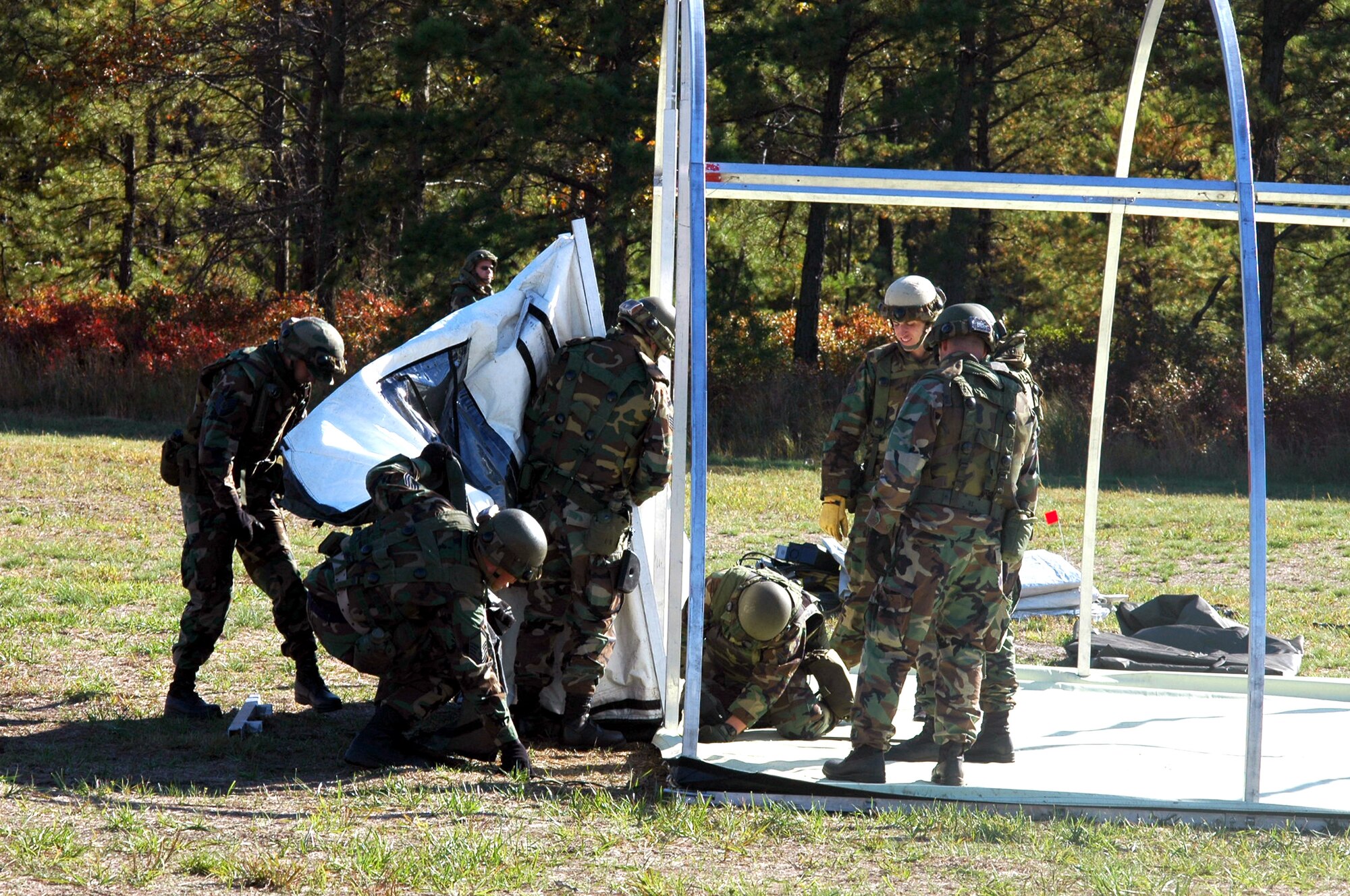 Airmen participating in Air Force Exercise Eagle Flag 07-1 as part of the "421st Air Expeditionary Group" work on building their main camp for the exercise Oct. 14 at Naval Air Engineering Station Lakehurst, N.J. The exercise saw more than 400 Airmen participate as they prepare for upcoming deployments. The exercise is operated by the Air Mobility Warfare Center's 421st Combat Training Squadron. (U.S. Air Force photo/Tech. Sgt. Scott T. Sturkol)
