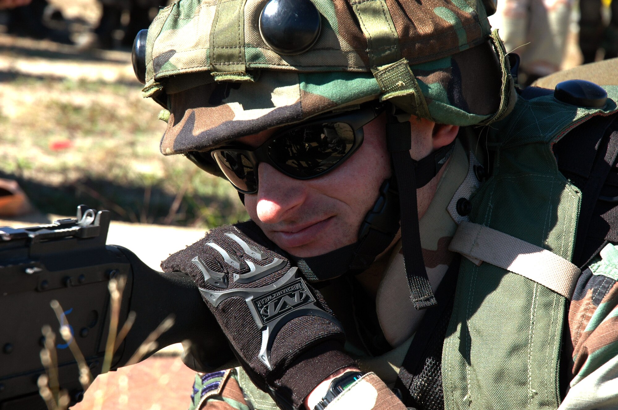 Airman 1st Class Travis Fillman watches over an entry control point with an M-60 machine gun as part of operations for Air Force Exercise Eagle Flag 07-1 Oct. 13 at Naval Air Engineering Station Lakehurst, N.J. Airman Fillman is a security forces journeyman from the 817th Contingency Response Group, McGuire AFB, N.J (U.S. Air Force photo/Tech. Sgt. Scott T. Sturkol)