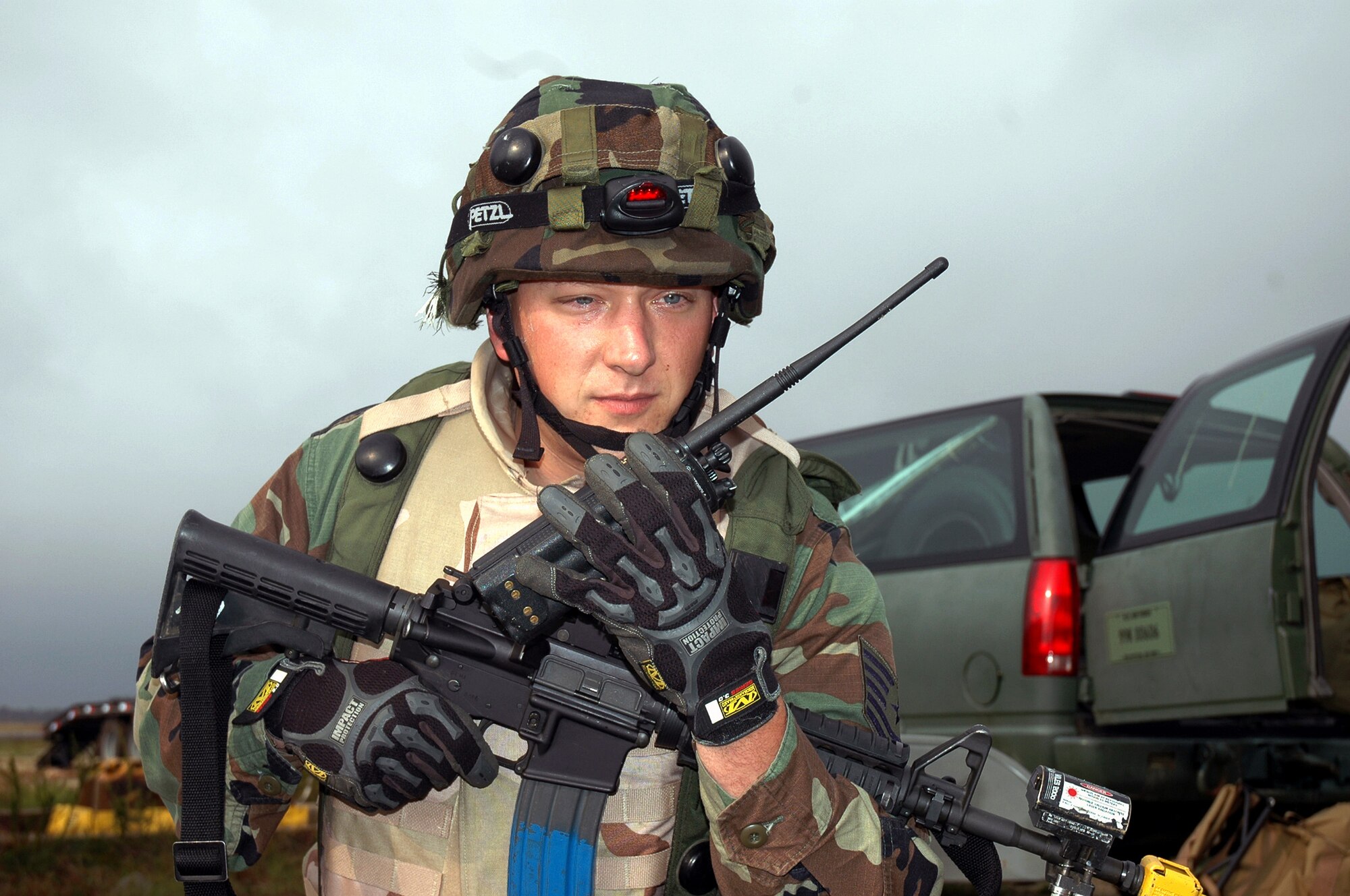 Tech. Sgt. Matthew Marcinkowski calls on the radio while watching over an entry control point to his camp area during operations for Exercise Eagle Flag 07-1 Oct. 12 at Naval Air Engineering Station Lakehurst, N.J. Sergeant Marcinkowski was one of eight people on an advance team setting up operations for Eagle Flag. The exercise is controlled and operated by the Air Mobility Warfare Center's 421st Combat Training Squadron and tests and trains Airmen in expeditionary combat support skills. Sergeant Marcinkowski is a civil engineer assistant with the 817th Contingency Response Group at McGuire Air Force Base, N.J. (U.S. Air Force photo/Tech. Sgt. Scott T. Sturkol)
