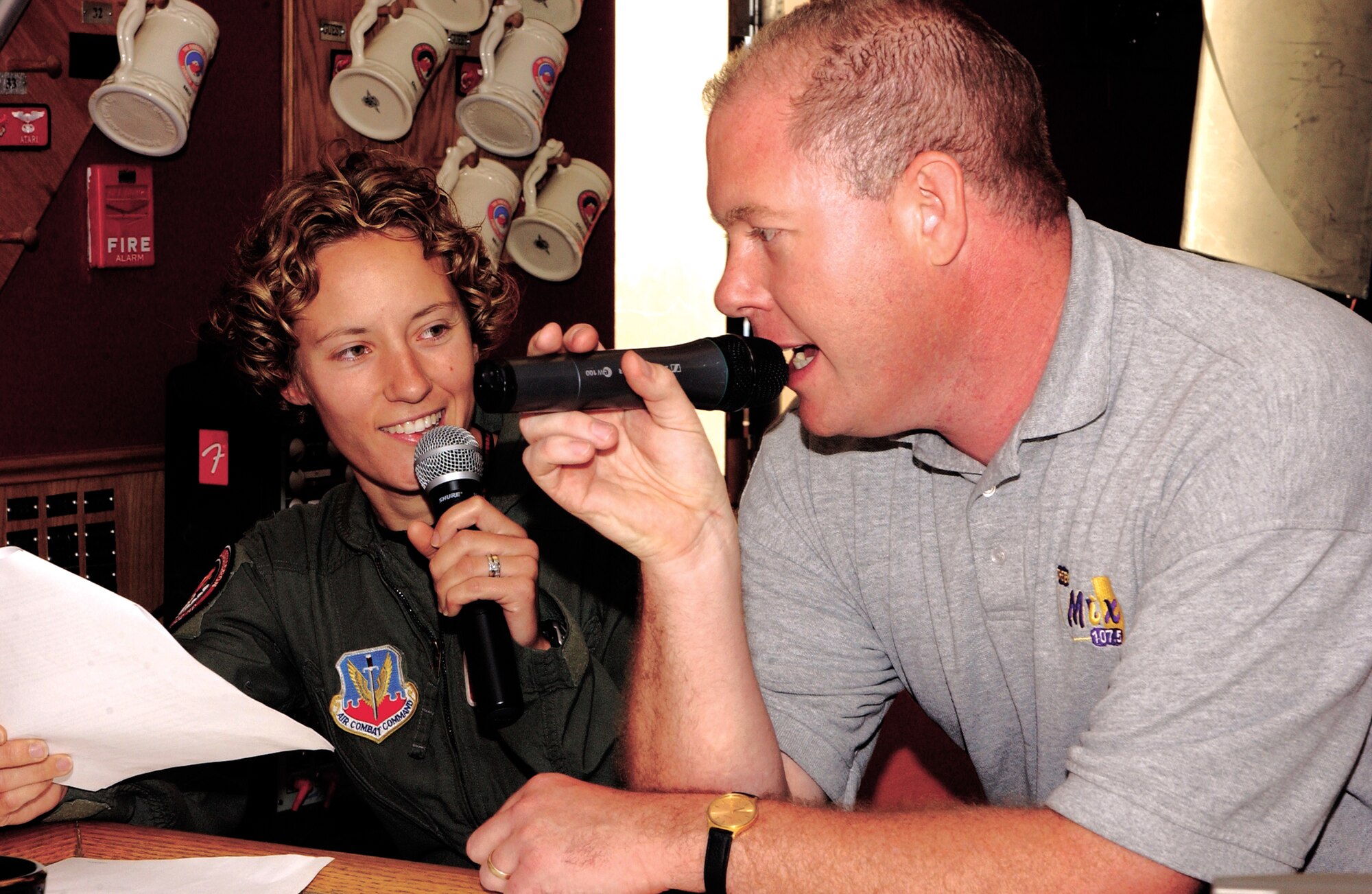 CANNON AIR FORCE BASE, N.M. -- Capt. Kristin Hubbard, a pilot with the 522nd Fighter Squadron, speaks with Steve Rooney, a local radio personality on 107.5 FM, during a live broadcast on Oct 5. Captain Hubbard and other  522 Airmen spoke about their career fields and military experiences. Talk show hosts Rooney and Duffy Moon visit Cannon regularly for an early morning show about Airmen and base activities. (U.S. Air Force photo/ Airman 1st Class Randi Rickards)
