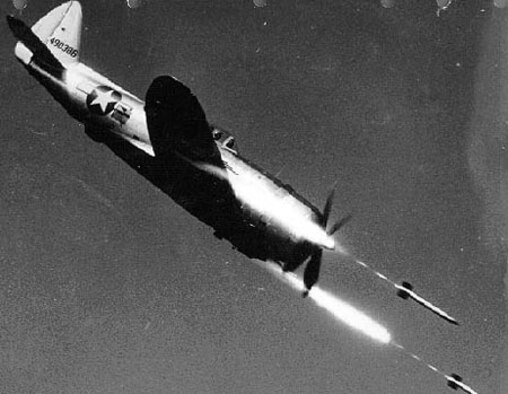Republic P-47D-40-RE (S/N 44-90386) in flight firing rockets. (U.S. Air Force photo)