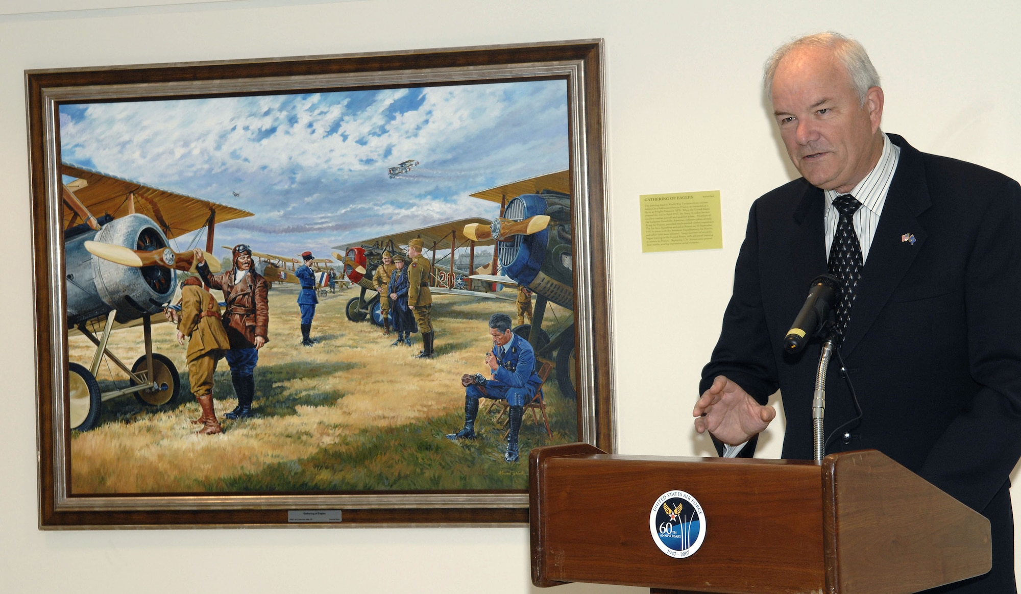 Secretary of the Air Force Michael W. Wynne recognizes artist Keith Ferris and the many other artists who have participated in the Air Force's art program during a ceremony Oct. 19 at the Pentagon commemorating the 60th Anniversary Art Exhibit. The paintings line the walls of the Air Force-maintained areas of the Pentagon.  (U.S. Air Force photo/Tech. Sgt. Cohen Young)