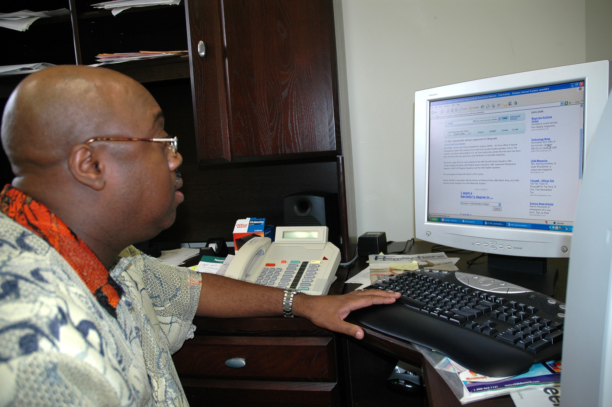 PATRICK AFB, Fla. -- Andre Johnson, 45th Space Wing Drug Demand Reduction Program manager, researches past Red Ribbon Week campaigns as he finalizes plans for the 2006 Red Ribbon Week, Oct. 23- 31. The theme is “United Against Drugs.” Mr. Johnson will speak with children at the Youth Center at Patrick AFB as well as two schools and a church. (U.S. Air Force photo by Staff Sgt. Patrick Brown)