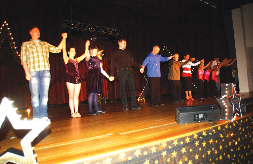 Contestants take a bow after the  final performance during the base talent show held at the base theater Oct. 12. The overall winner was Senior Airman Sara Baker, 791st Missile Security Forces Squadron. Airman Baker will now go on to compete at the Air Force level. 