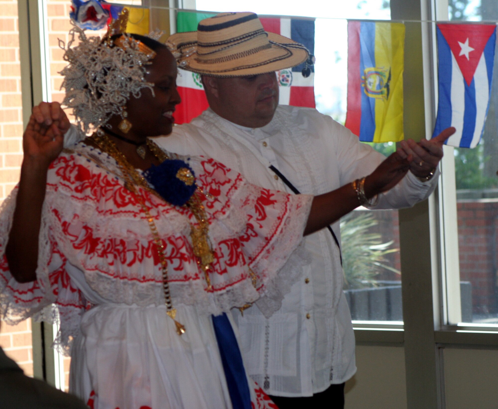 Vielka Forbes, 16th Services Squadron dances a Panamanian folk dance with her partner, Staff Sgt. Detley Waldrop, 16th Component Maintenance Squadron Oct. 12 at The Soundside. (U.S. Air Force Photograph by Staff Sgt. Kelly Ogden)