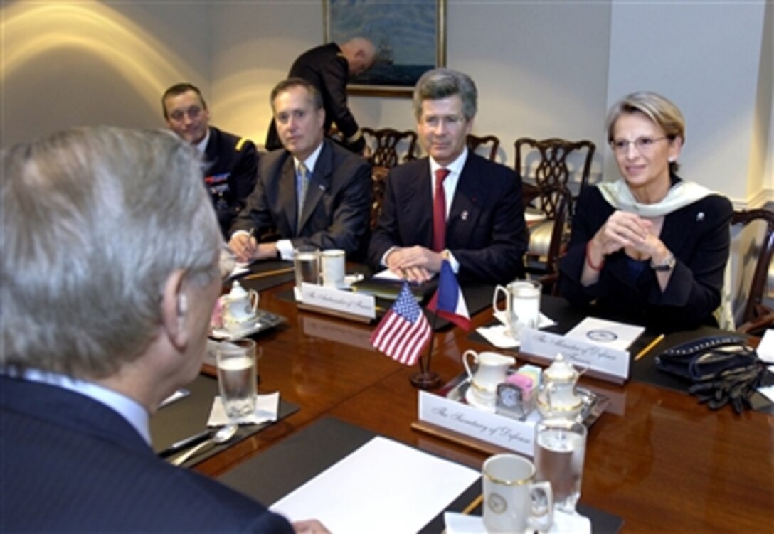 French Minister of Defense Michelle Alliot-Marie, right, along with French Ambassador Jean David Levitte, seated to the left of her, meet with Secretary of Defense Donald H. Rumsfeld, left foreground, in the Pentagon, Oct. 19, 2006.